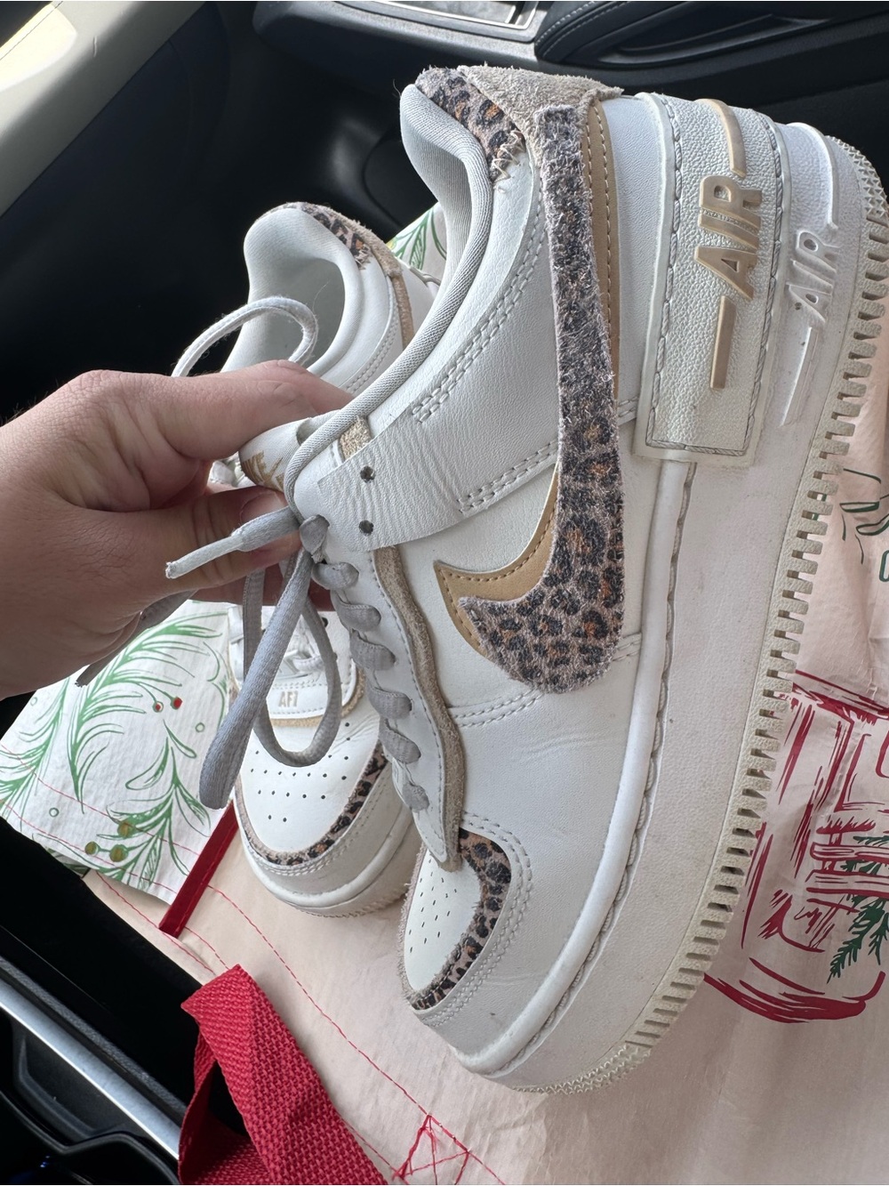 Nike Women’s White Sneakers with Beige Trim and Leopard Swoosh